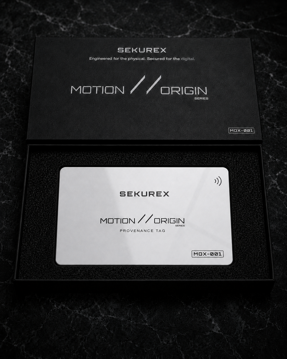 SEKUREX Motion // Origin presentation box open, revealing the white MOX-001 provenance key seated in foam